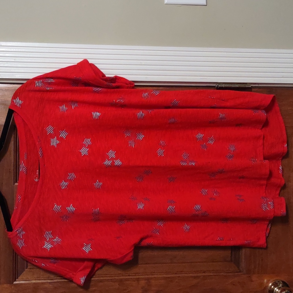 Women's red top with blue and silver stars